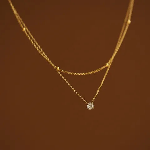 Collar doble con punto de luz