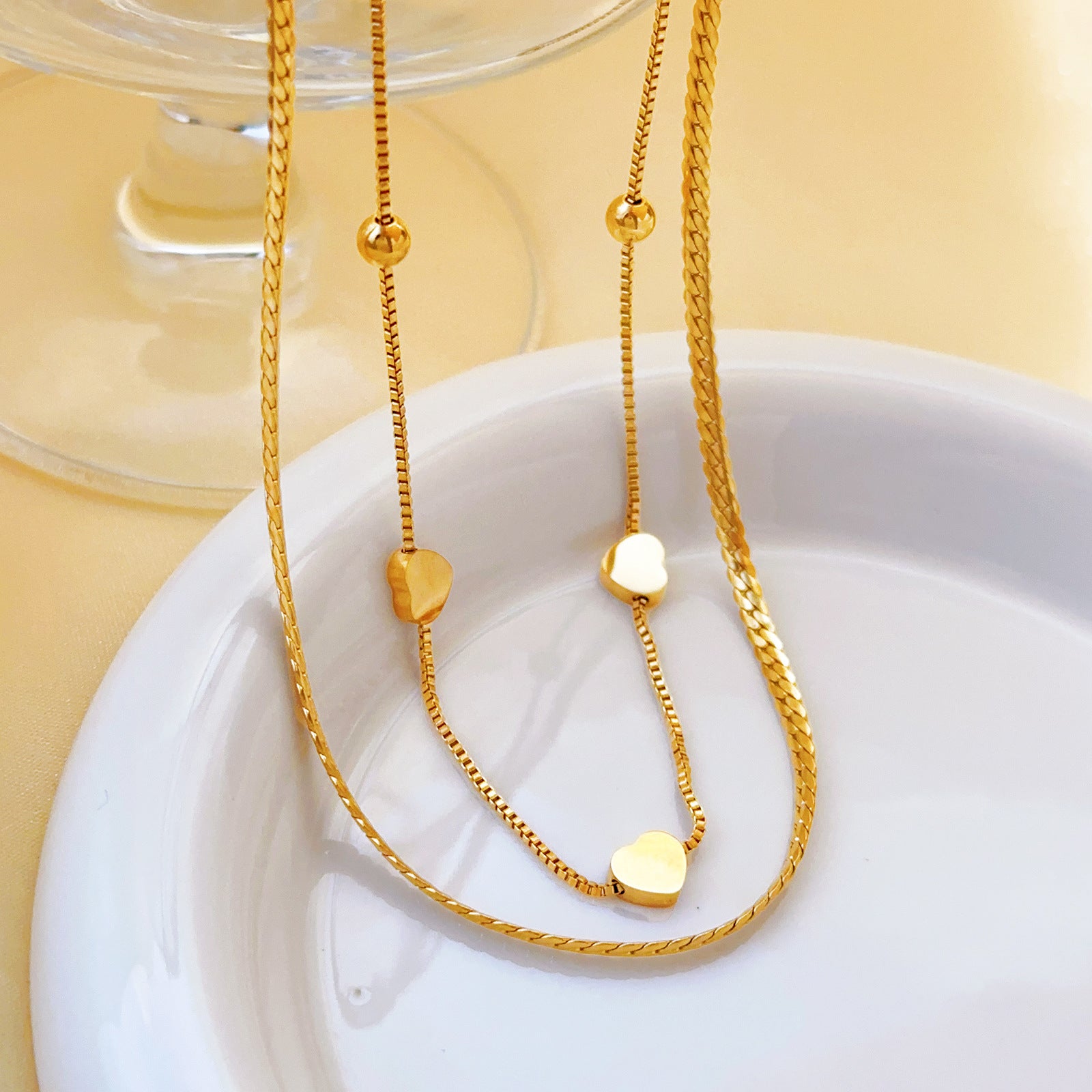 Collar doble con triple corazon