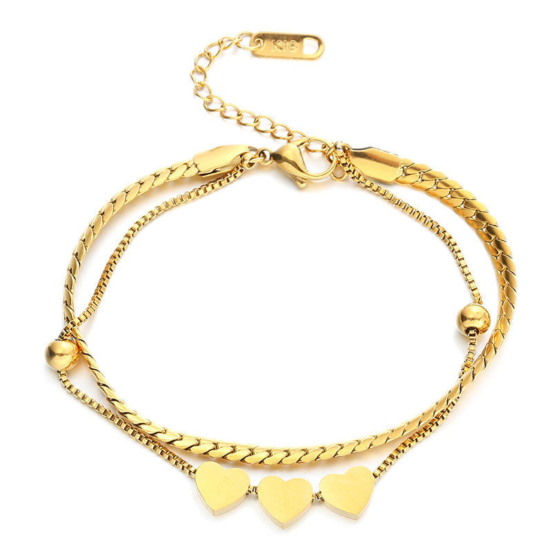 Pulsera doble con triple corazon