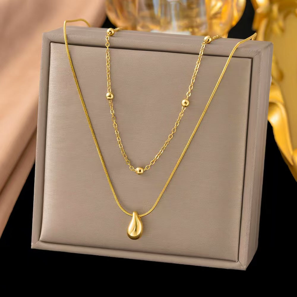 Collar doble de balines con dije de gota