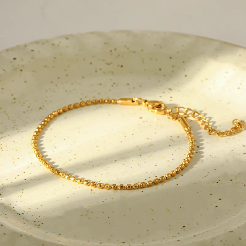 Pulsera basica de cuentas conectadas - Dorado