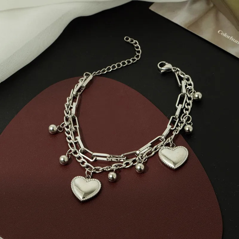 Pulsera doble con balines y corazones