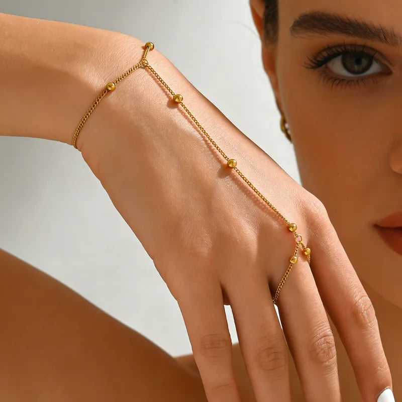 Pulsera de dedo con balines