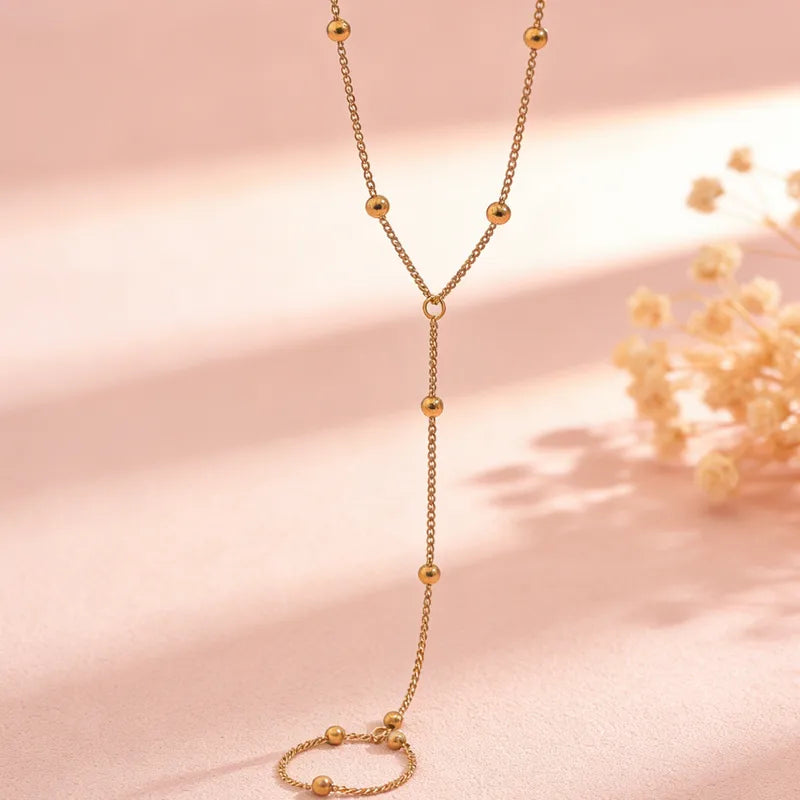 Pulsera de dedo con balines