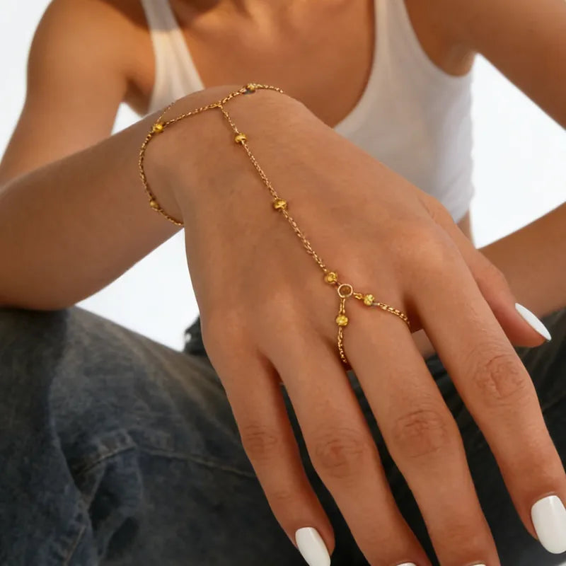 Pulsera de dedo con balines