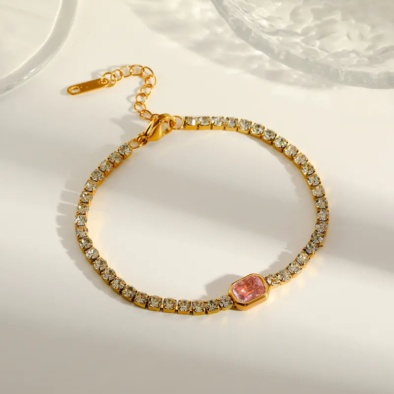 Pulsera tipo tenis con dije rosa