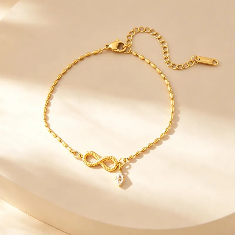 Pulsera de infinito con cristal colgante
