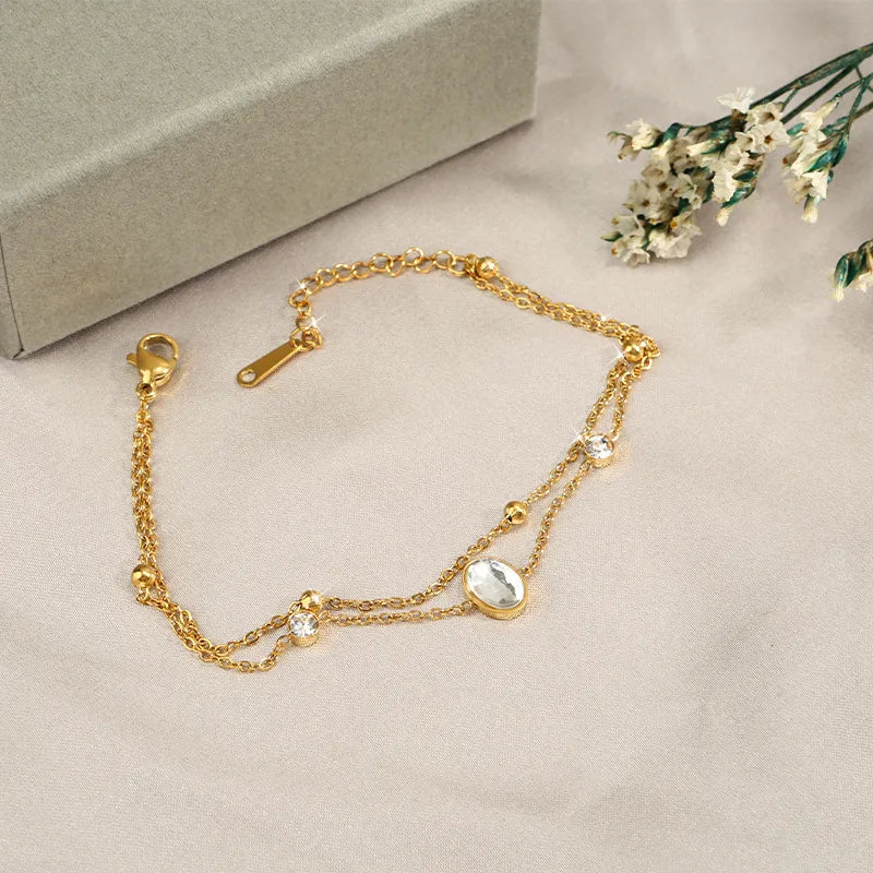 Pulsera doble con dije de ovalo elegante