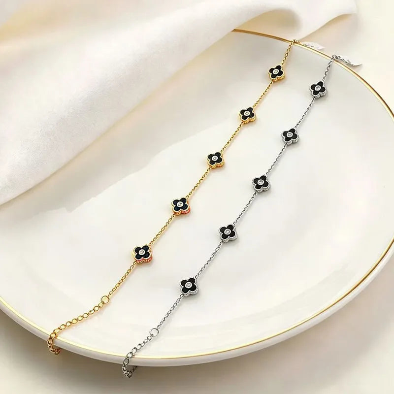 Pulsera de trebol negro - Dorado