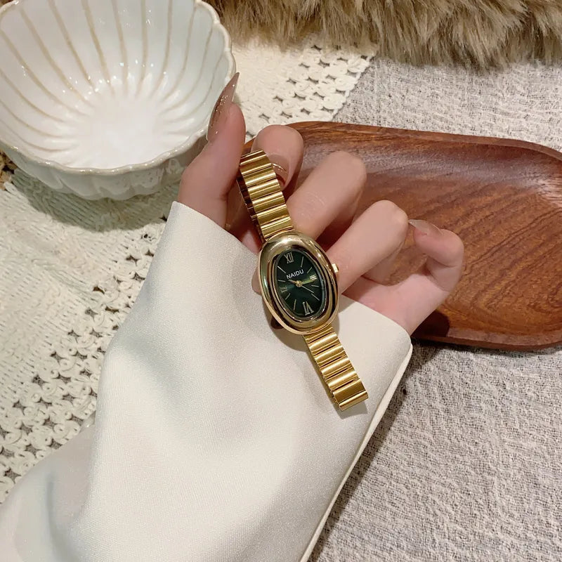 Reloj Naidu Luxury - Dorado con bisel verde