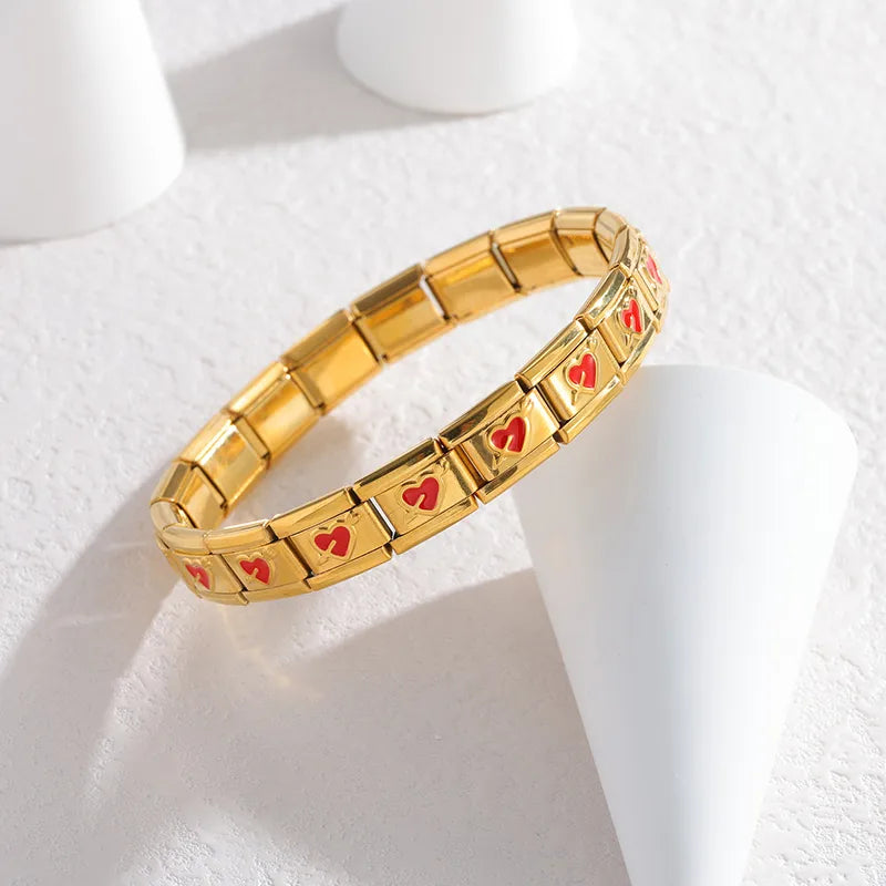 Brazalete italiano dorado con corazones rojos